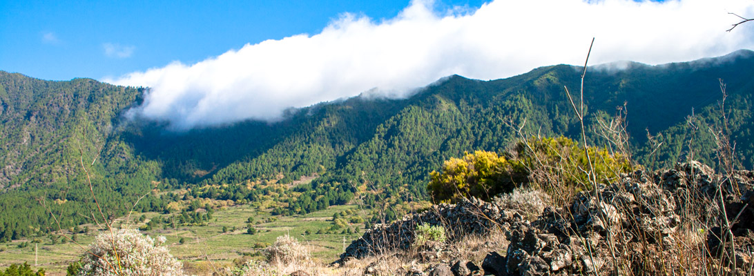 The Cumbre La Palmas with trade wind clouds